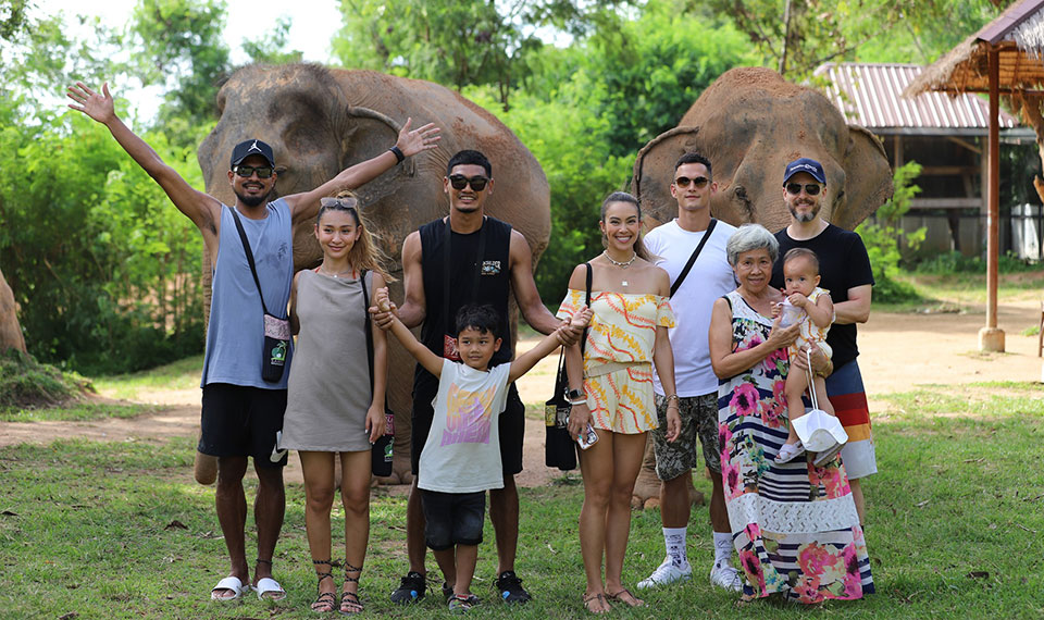 family posing in front of elephants - Koh Samui Elephant Sanctuary