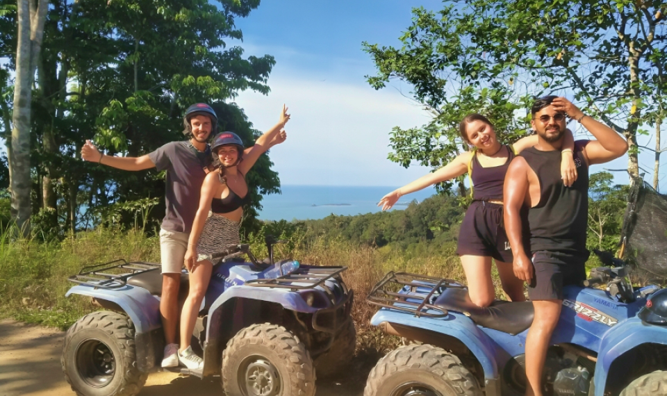 ATV riding, ready to explore the rugged landscapes on their Samui tour