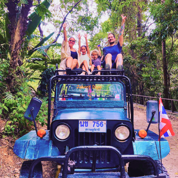 Joyful travelers on top of a safari Jeep on Koh Samui private tour